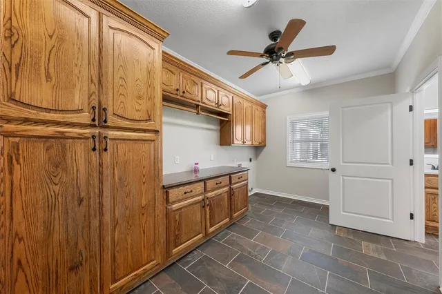 a kitchen with stainless steel appliances a stove and cabinets