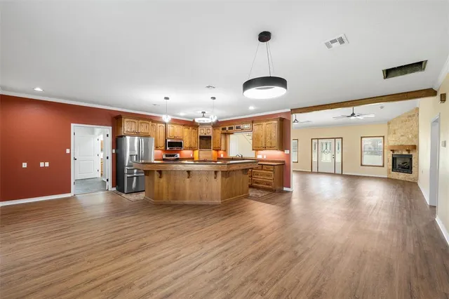 a living room with furniture and kitchen view