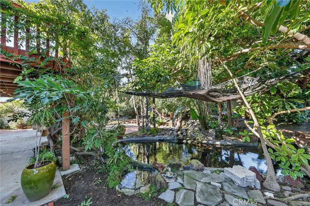 a view of a chair and tables in the patio