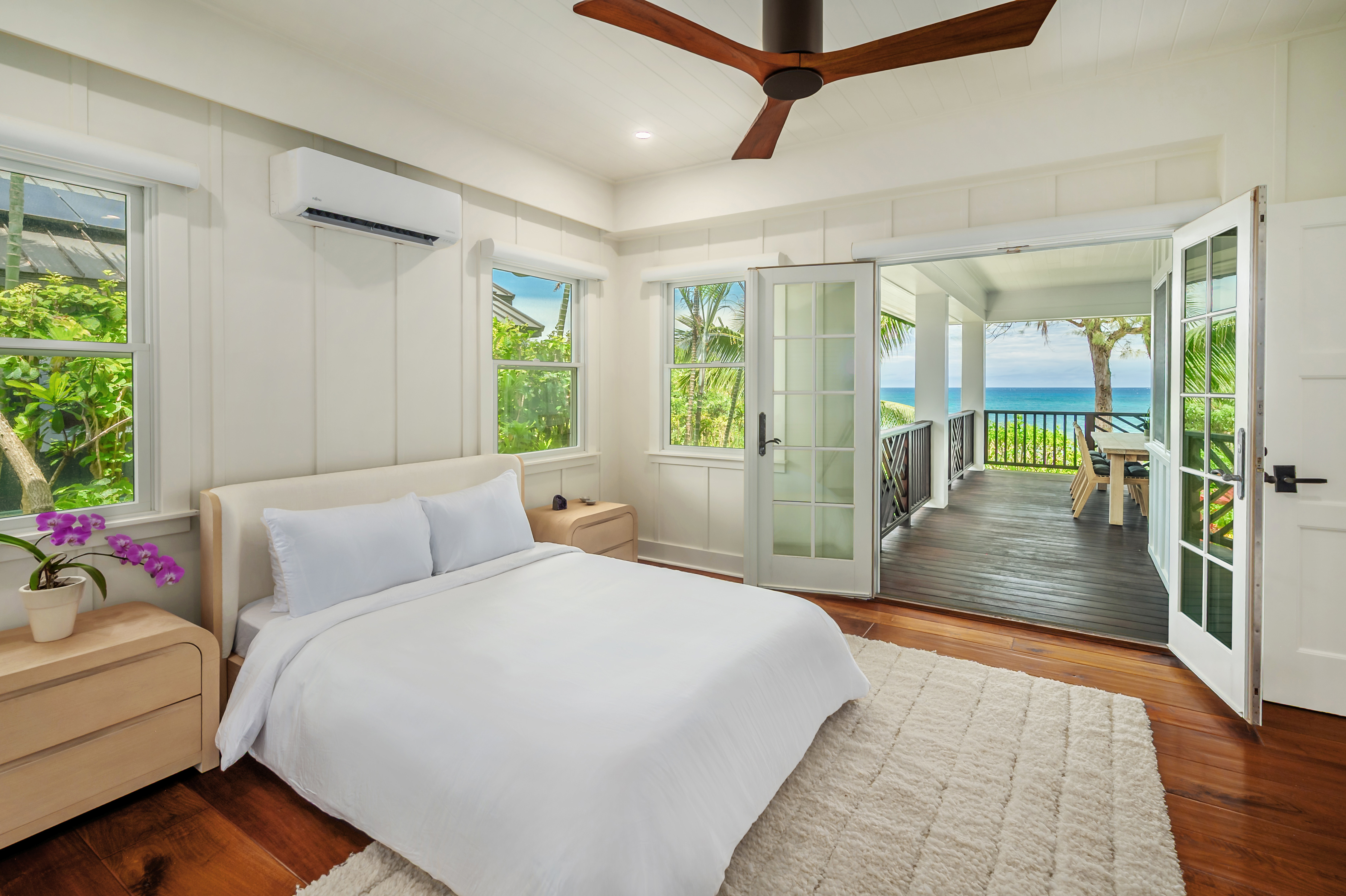 7336 Alealea Road Hanalei, HI 96714 - Photo 19 of 30 a bedroom with a bed and a large window with balcony view