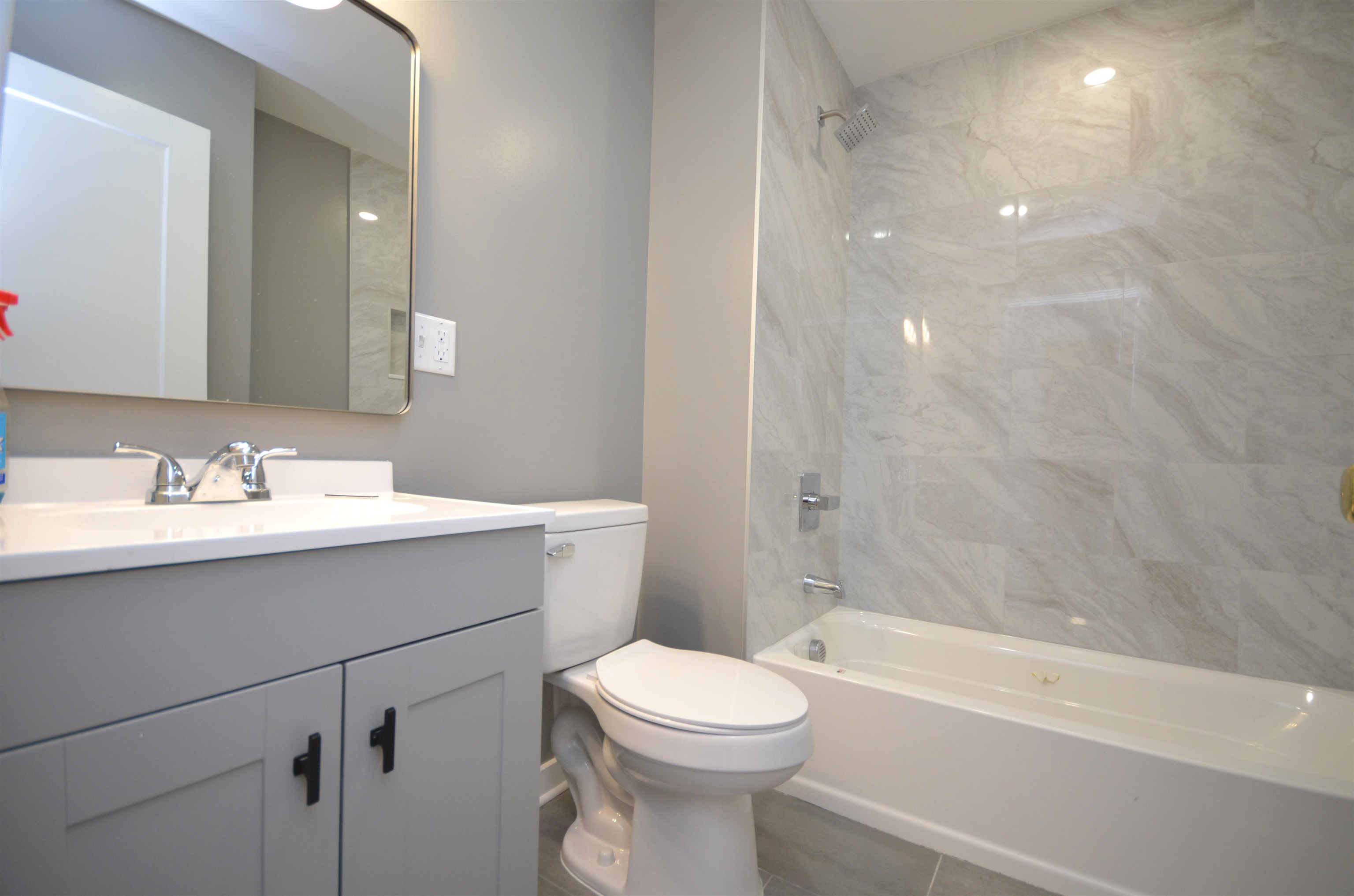 413 Davis Avenue, Unit 2 Harrison, NJ 07029 - Photo 5 of 8 a bathroom with a sink a toilet and shower