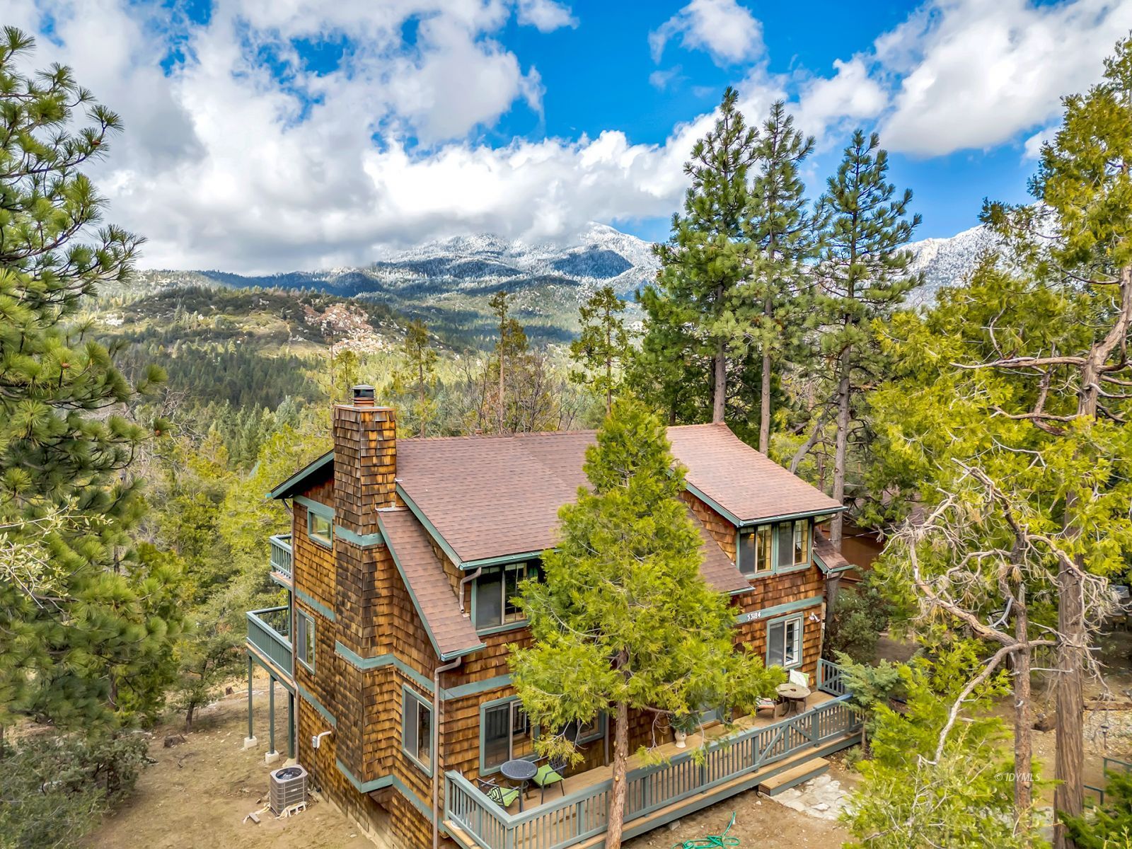 an aerial view of a residential apartment building with a yard