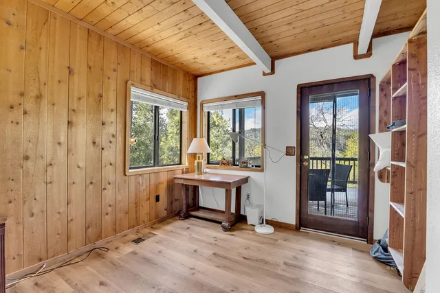 a view of kitchen with furniture and large windows