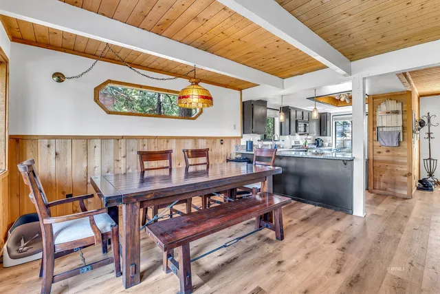 a kitchen with granite countertop kitchen island a sink a counter space and stainless steel appliances