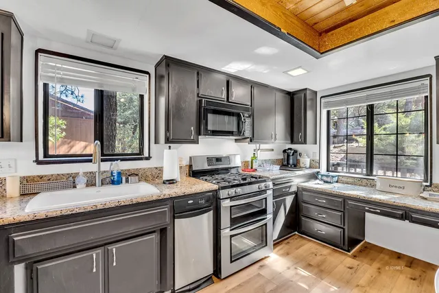 a bathroom with a sink a washer and dryer