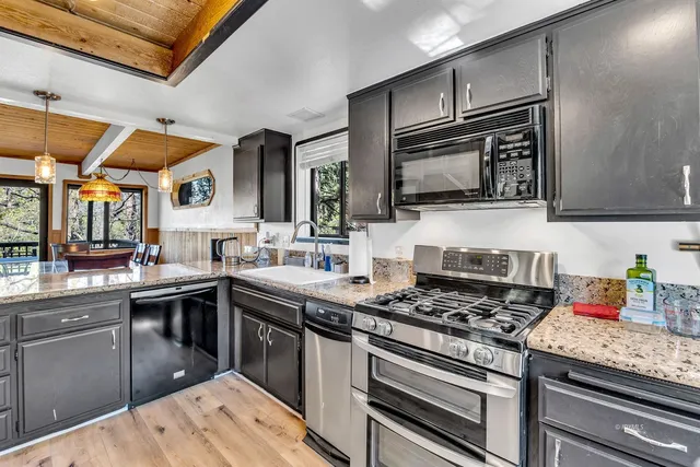 a view of a living room and hardwood floor