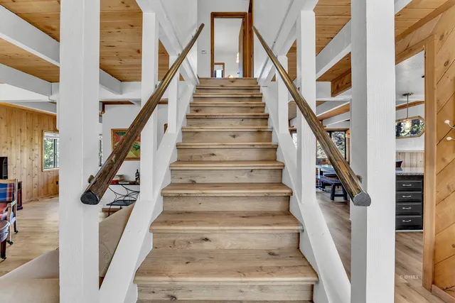 a large bedroom with a large bed and a large window