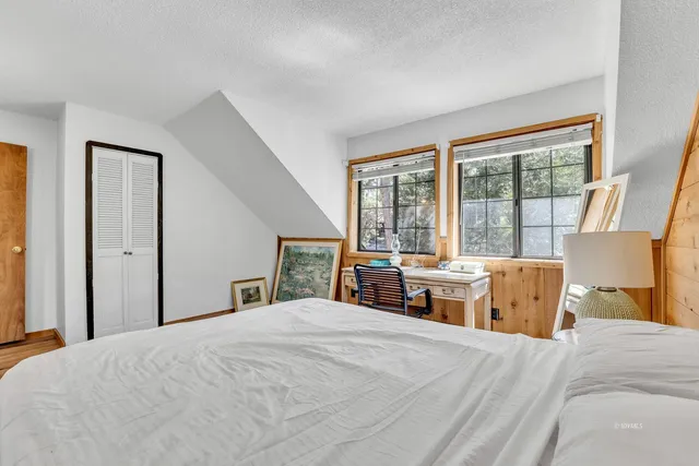 a balcony with table and chairs