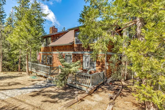 a view of a brick house with many windows
