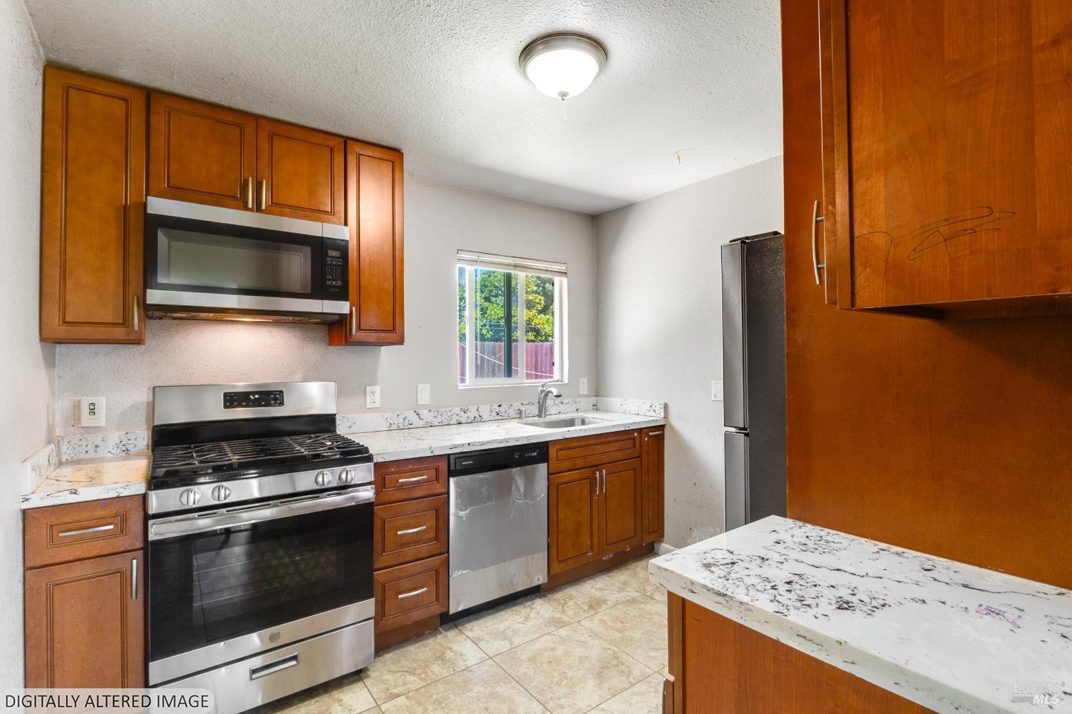 1722 Indiana Street Fairfield, CA 94533 - Photo 3 of 18 a kitchen with granite countertop cabinets stainless steel appliances and a counter space