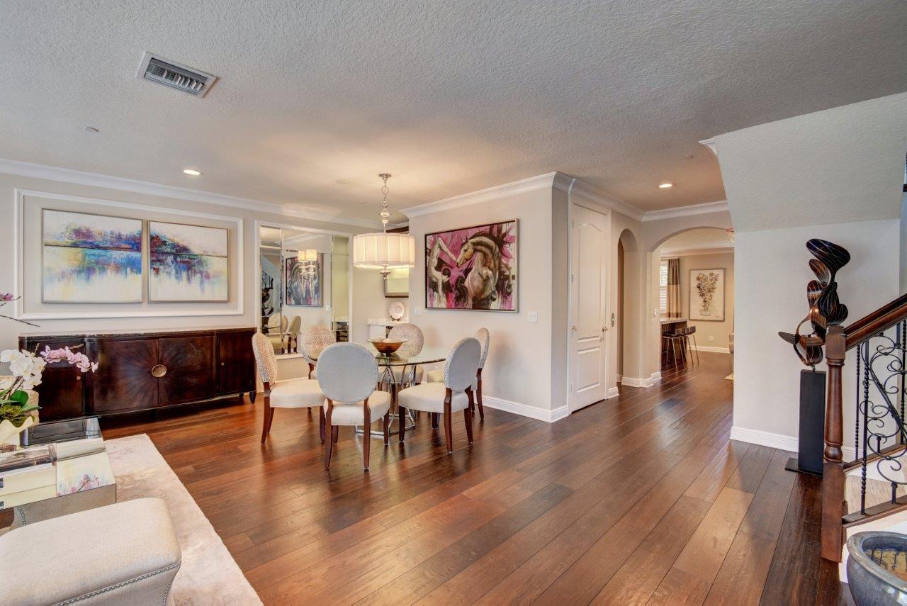 5610 Northeast Trieste Terrace Boca Raton, FL 33487 - Photo 17 of 44 a view of a dining room with furniture window and wooden floor