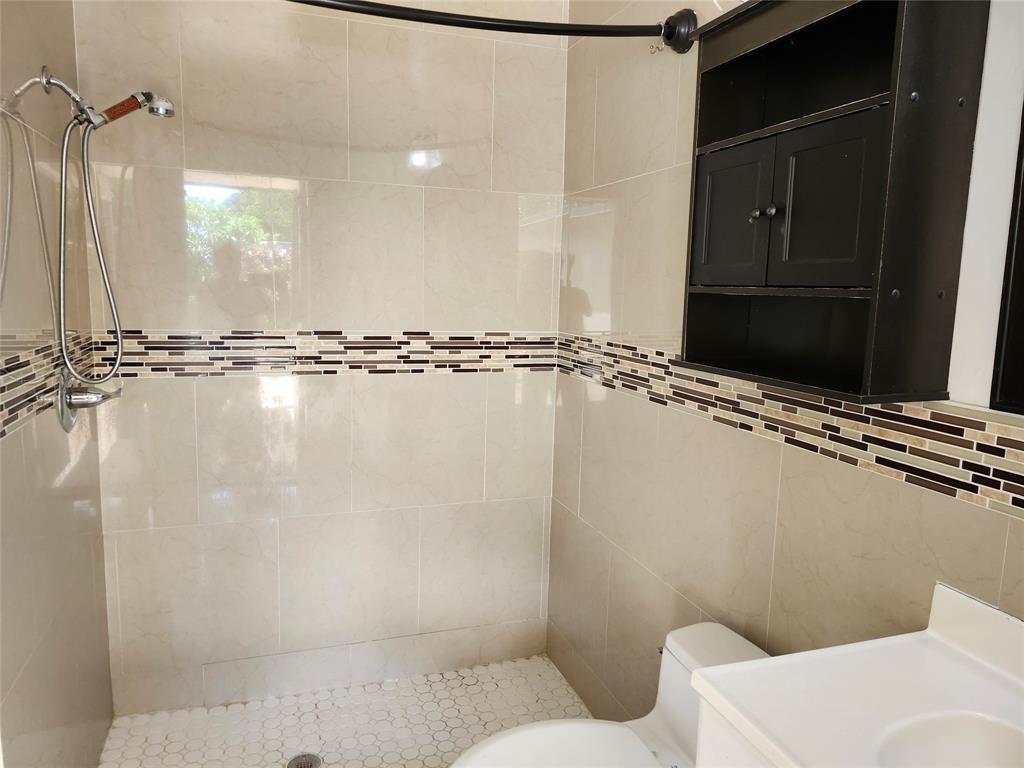 10720 Eureka Street Boca Raton, FL 33428 - Photo 12 of 18 a bathroom with a shower and a toilet