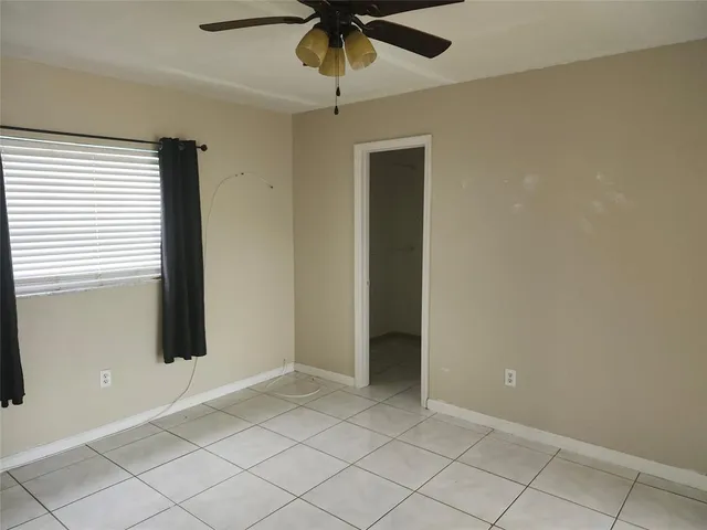 a view of an empty room and window