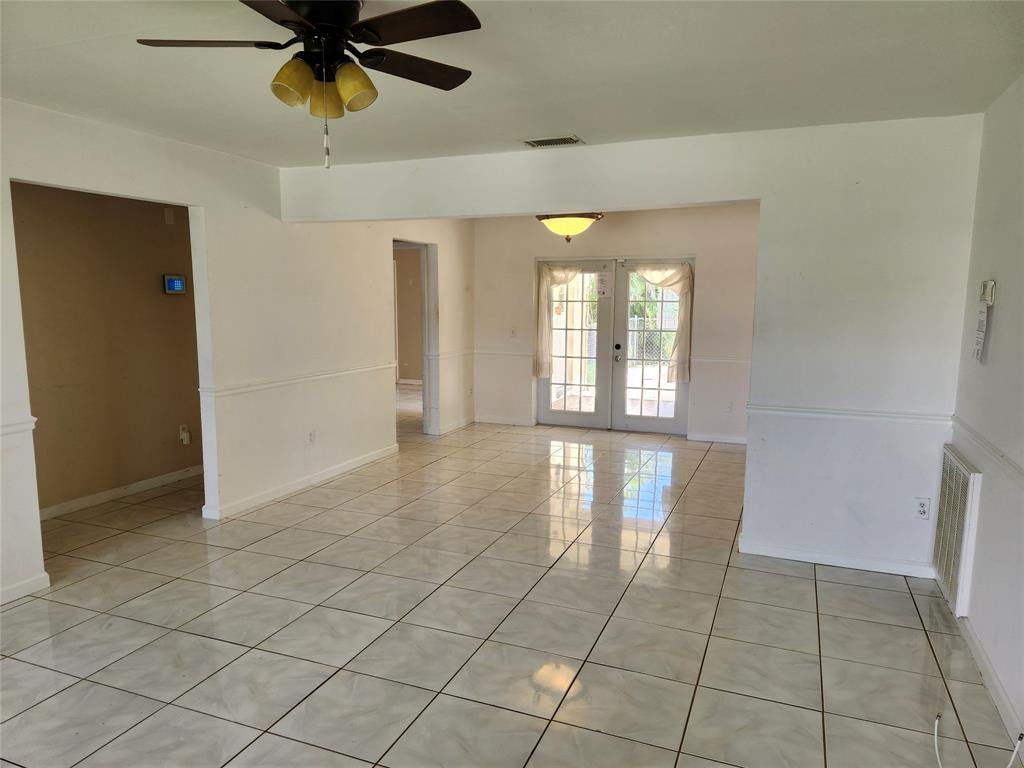 10720 Eureka Street Boca Raton, FL 33428 - Photo 3 of 18 a view of an empty room and window