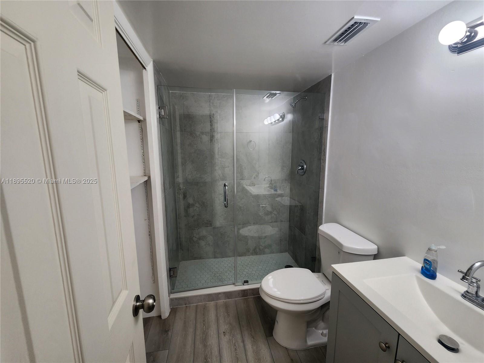 11309 Southwest 200th Street, Unit 303C Miami, FL 33157 - Photo 12 of 21 a bathroom with a sink and a toilet