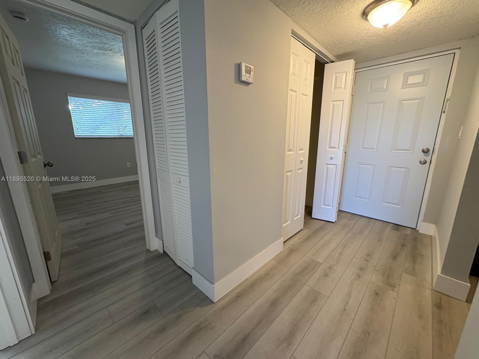 11309 Southwest 200th Street, Unit 303C Miami, FL 33157 - Photo 18 of 21 wooden floor in an empty room