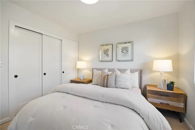 a bedroom with a bed and a view of bedroom