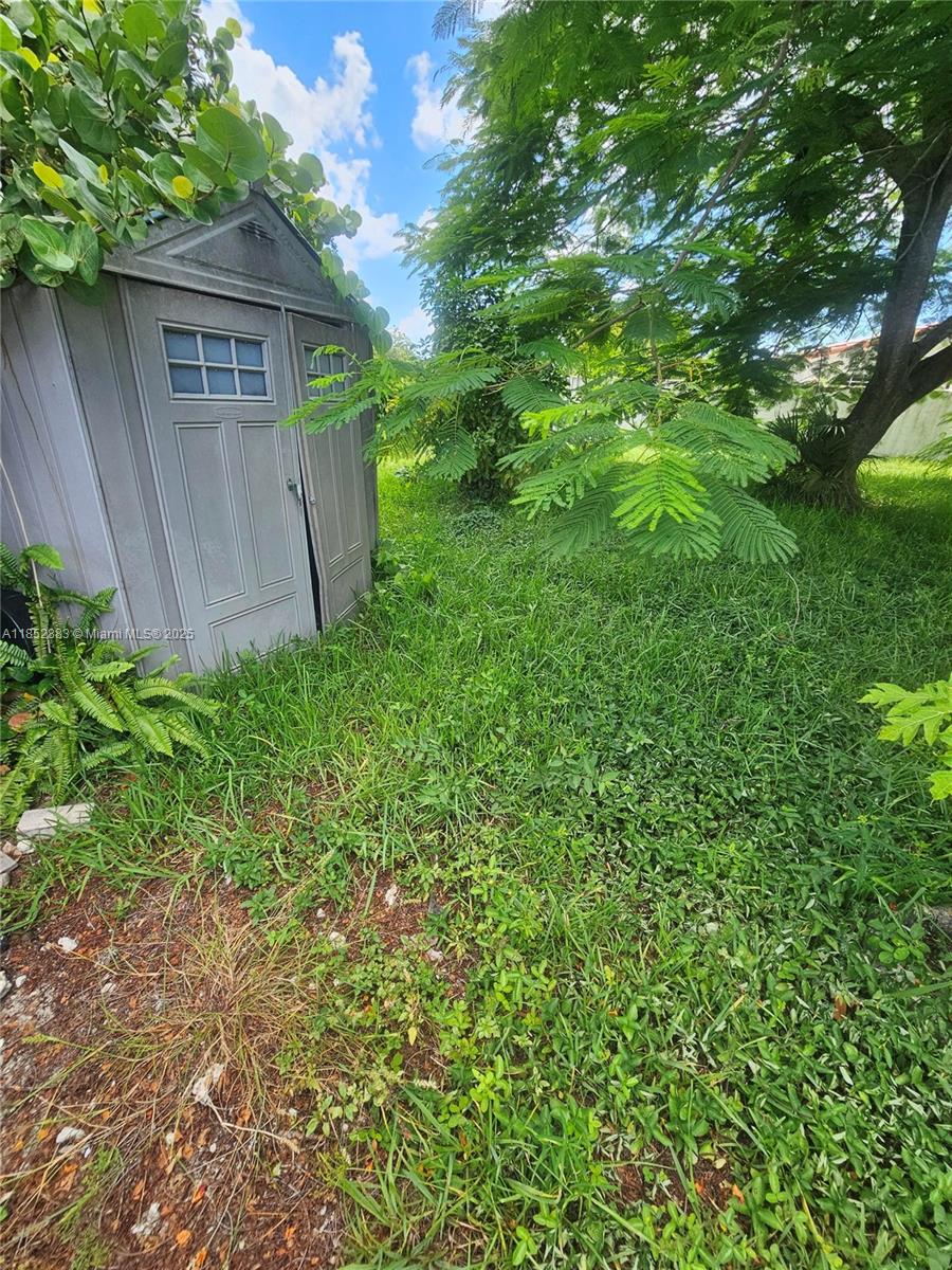 0 East 52nd Hialeah, FL 33013 - Photo 3 of 8 a view of a house with a yard and plants