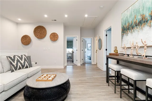 a spacious bedroom with a bed and a couch