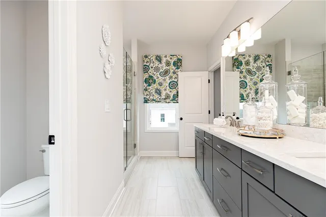 a bed room with a bed window and a chair