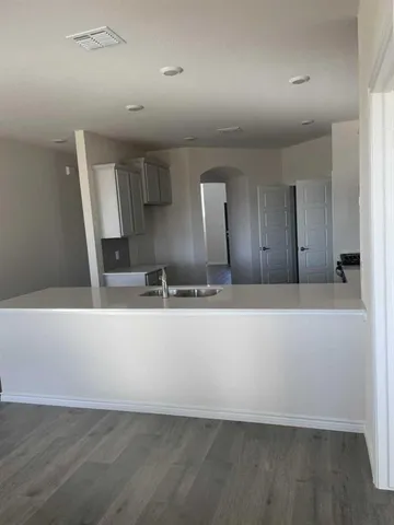 an empty room with wooden floor