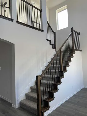 a view of entryway with wooden floor