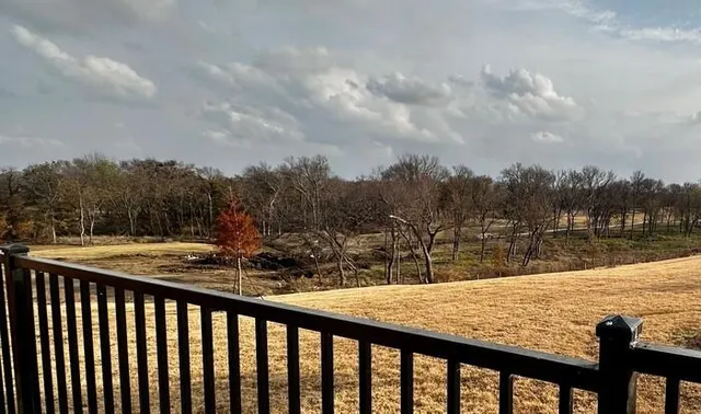 a view of swimming pool from a balcony