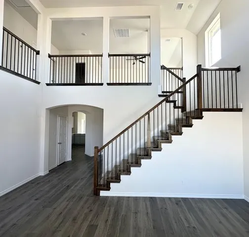 a view of an entryway with wooden floor