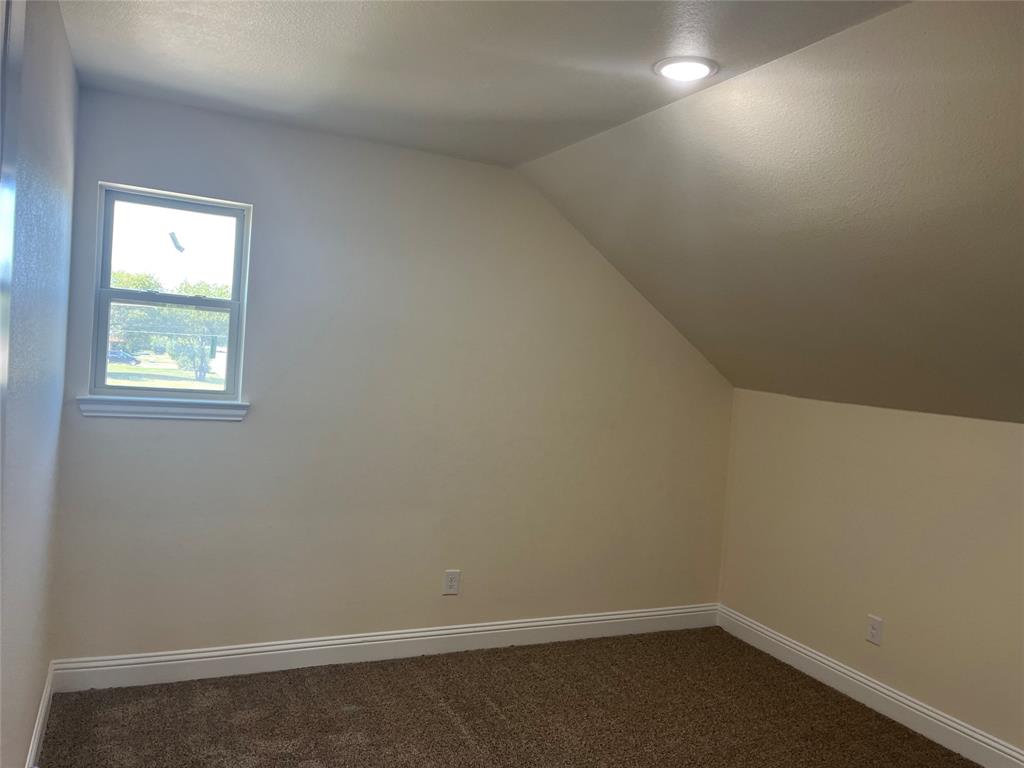 5332 Booker T Street Fort Worth, TX 76105 - Photo 16 of 18 an empty room with a window