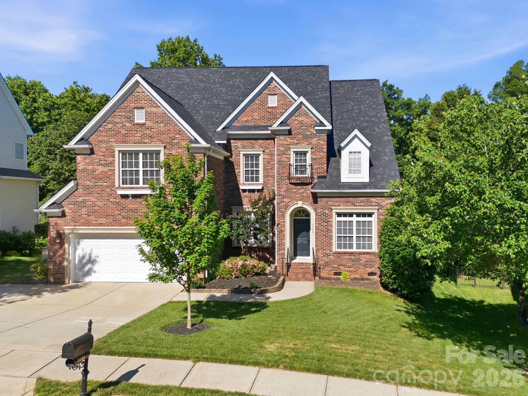 3308 Grandeur Road Charlotte, NC 28269 - Photo 1 of 45 a front view of a house with a yard