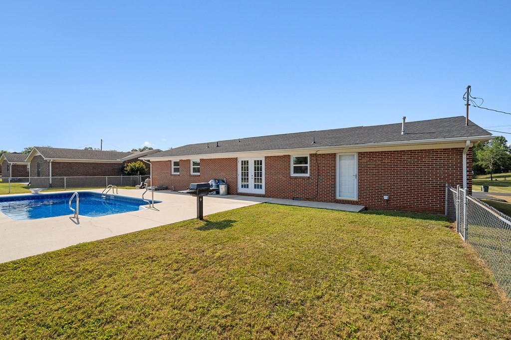 210 Gillen Drive Sparta, TN 38583 - Photo 14 of 16 a swimming pool with outdoor seating and yard
