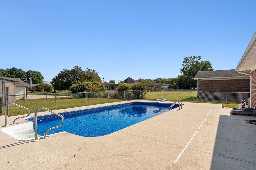 210 Gillen Drive Sparta, TN 38583 - Photo 16 of 16 a view of a swimming pool and lounge chairs
