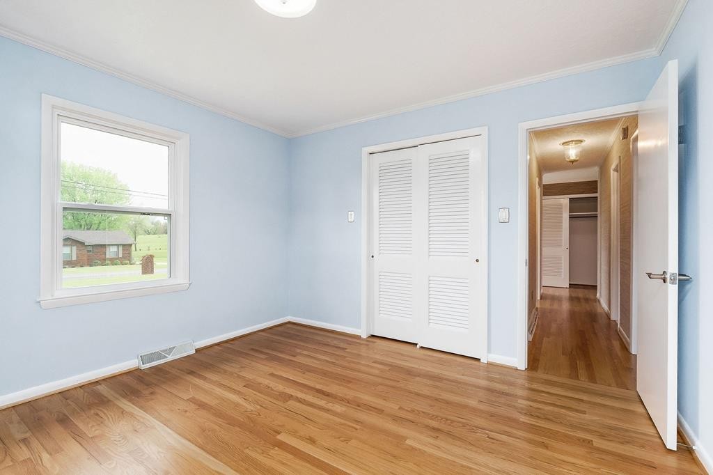 210 Gillen Drive Sparta, TN 38583 - Photo 6 of 16 a view of empty room with wooden floor and fan