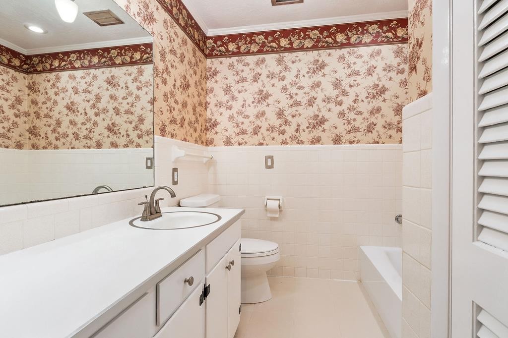 210 Gillen Drive Sparta, TN 38583 - Photo 8 of 16 a bathroom with a sink and a mirror