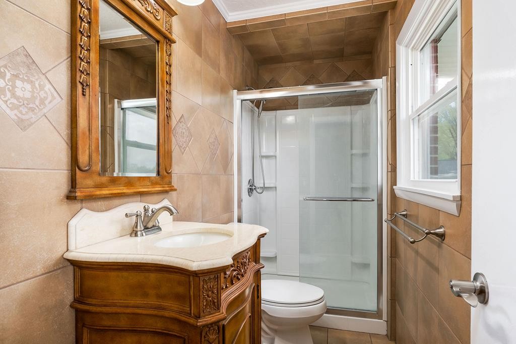 210 Gillen Drive Sparta, TN 38583 - Photo 9 of 16 a bathroom with a sink toilet and shower