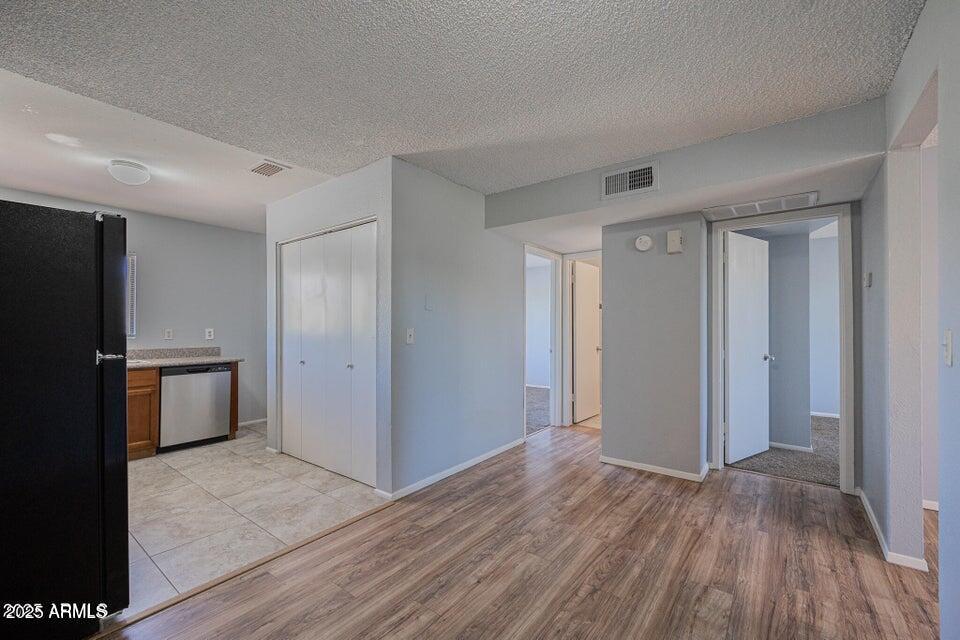127 South Outpost Road, Unit 4 Apache Junction, AZ 85119 - Photo 8 of 8 a view of empty room with wooden floor