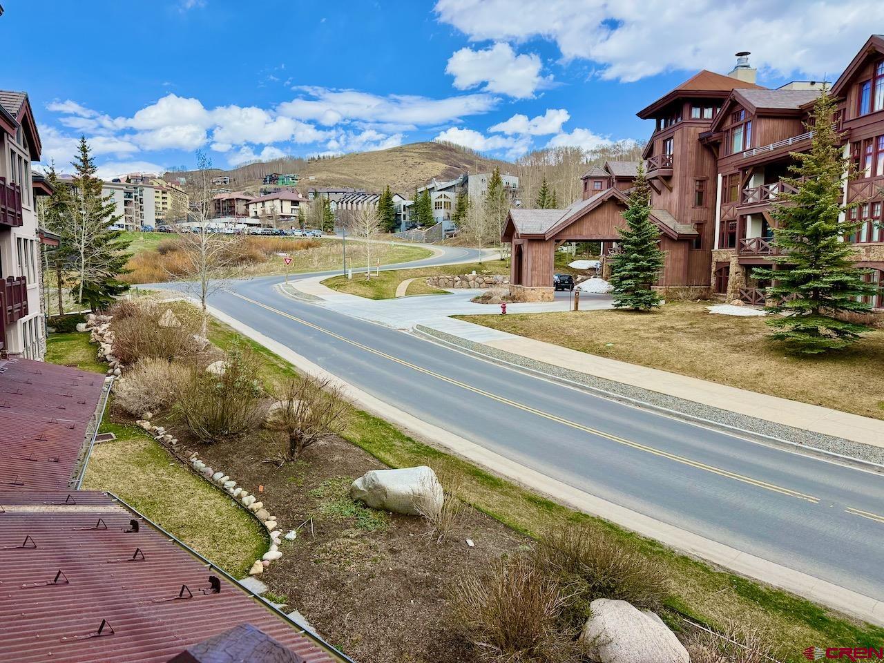 9 Hunter Hill Road, Unit 205 Crested Butte, CO 81225 - Photo 12 of 28 a view of an house with swimming pool and sitting area