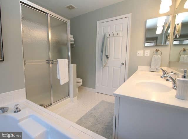 1330 Wedgewood Manor Way Reston, VA 20194 - Photo 13 of 30 a spacious bathroom with a tub shower and sink