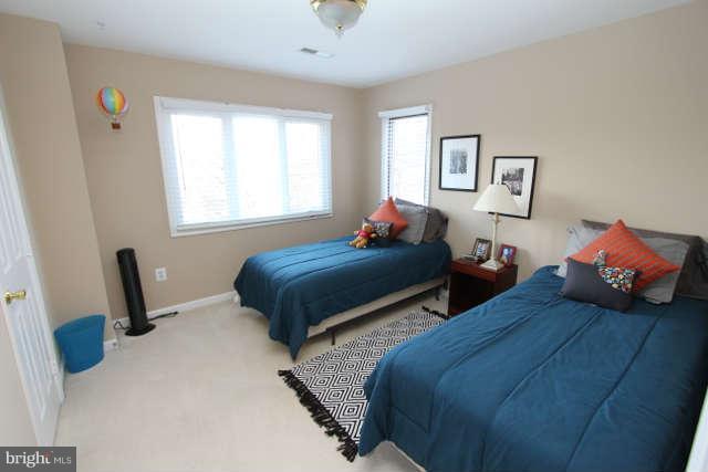 1330 Wedgewood Manor Way Reston, VA 20194 - Photo 15 of 30 a bedroom with two beds and a window