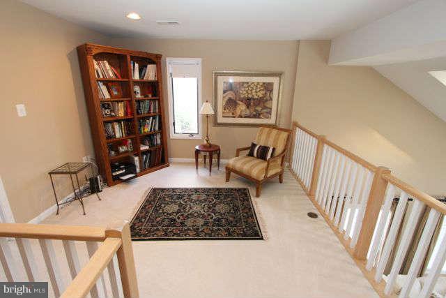 1330 Wedgewood Manor Way Reston, VA 20194 - Photo 16 of 30 a living room with furniture and a rug