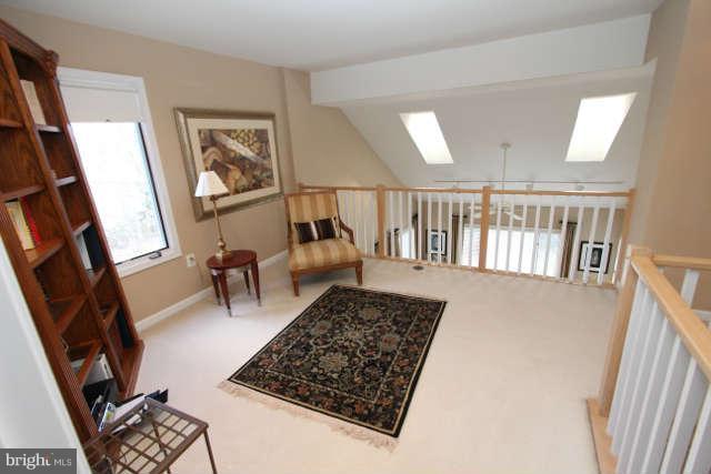1330 Wedgewood Manor Way Reston, VA 20194 - Photo 17 of 30 a living room with furniture and a rug
