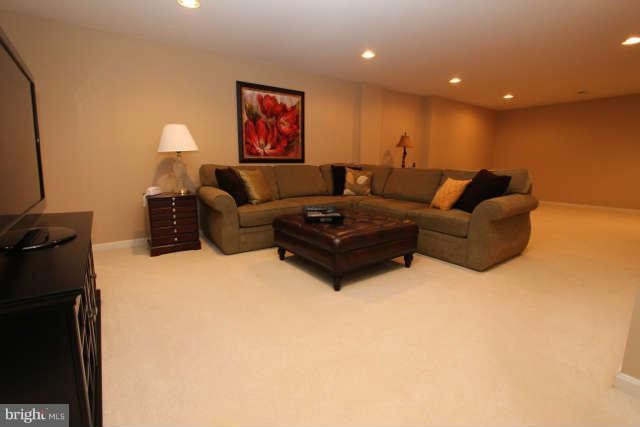 1330 Wedgewood Manor Way Reston, VA 20194 - Photo 21 of 30 a living room with furniture and a flat screen tv