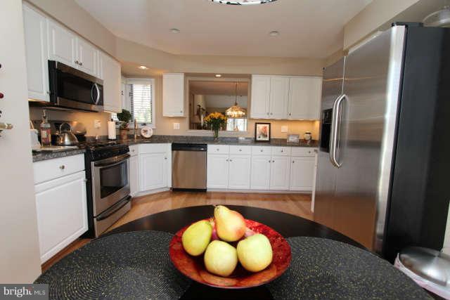 1330 Wedgewood Manor Way Reston, VA 20194 - Photo 5 of 30 a kitchen with a sink stainless steel appliances and cabinets