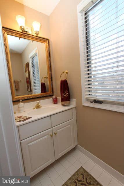 1330 Wedgewood Manor Way Reston, VA 20194 - Photo 6 of 30 a bathroom with a sink and a mirror