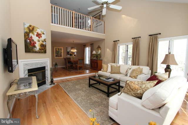 1330 Wedgewood Manor Way Reston, VA 20194 - Photo 9 of 30 a living room with furniture and a fireplace