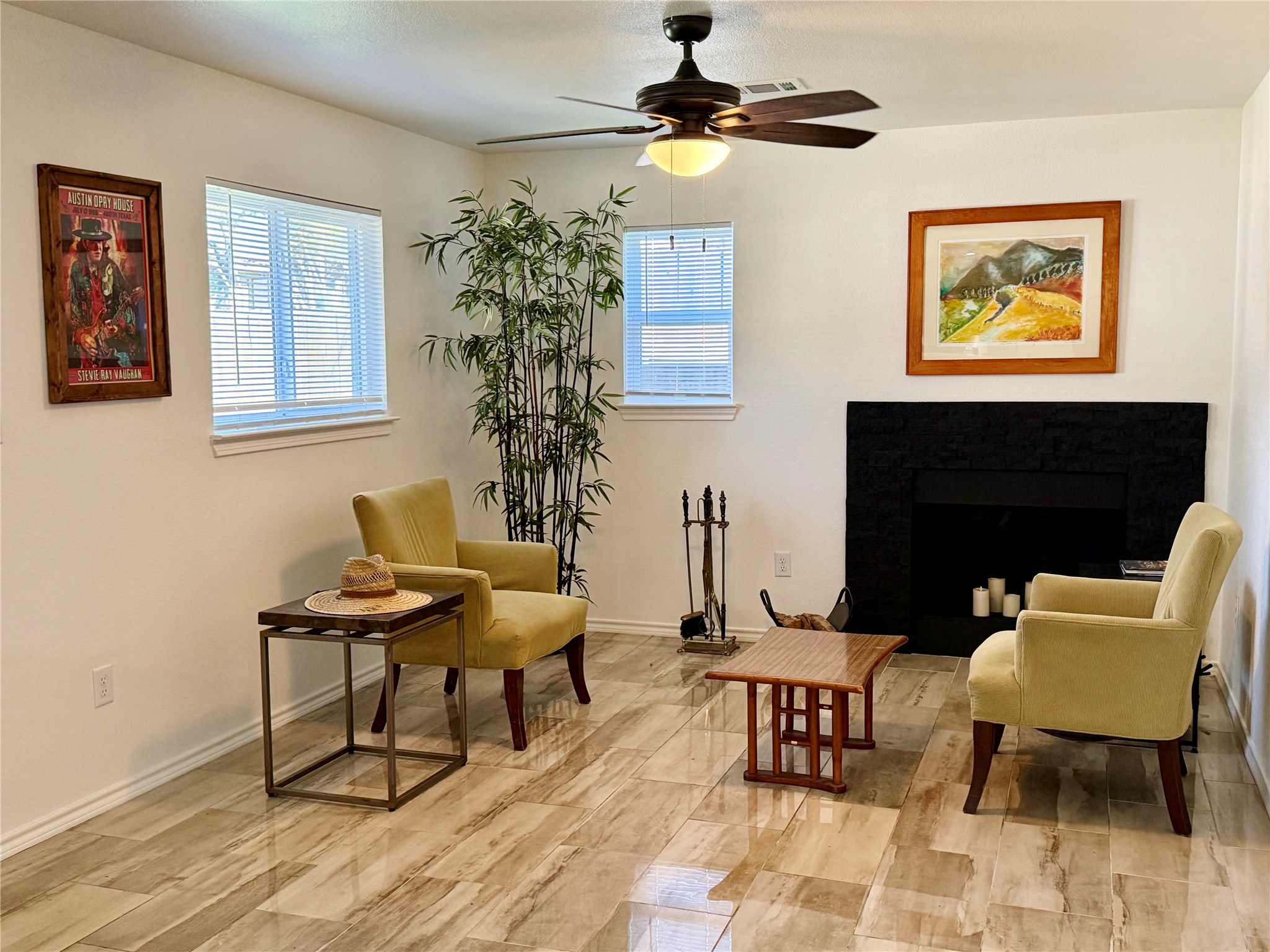 301 Sheraton Avenue Austin, TX 78745 - Photo 4 of 27 Open and warm living area with statement fireplace and natural light.
