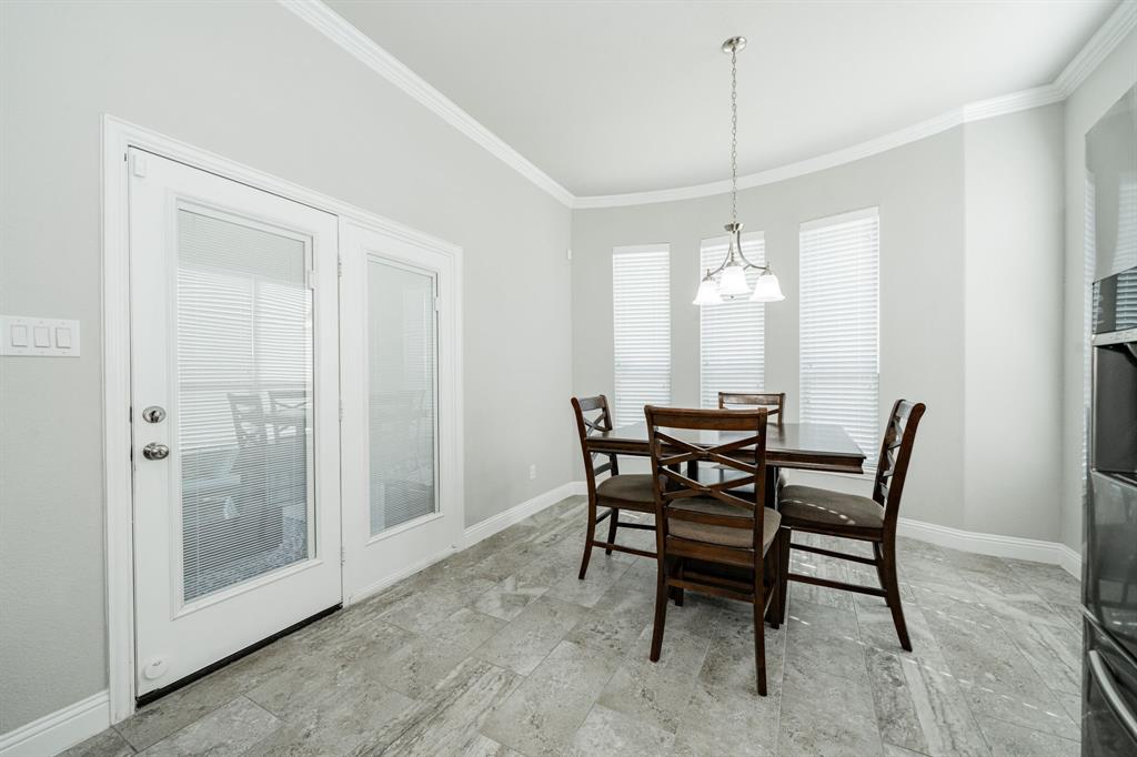 593 Spruce Trail Forney, TX 75126 - Photo 14 of 40 Dining area with baseboards and crown molding