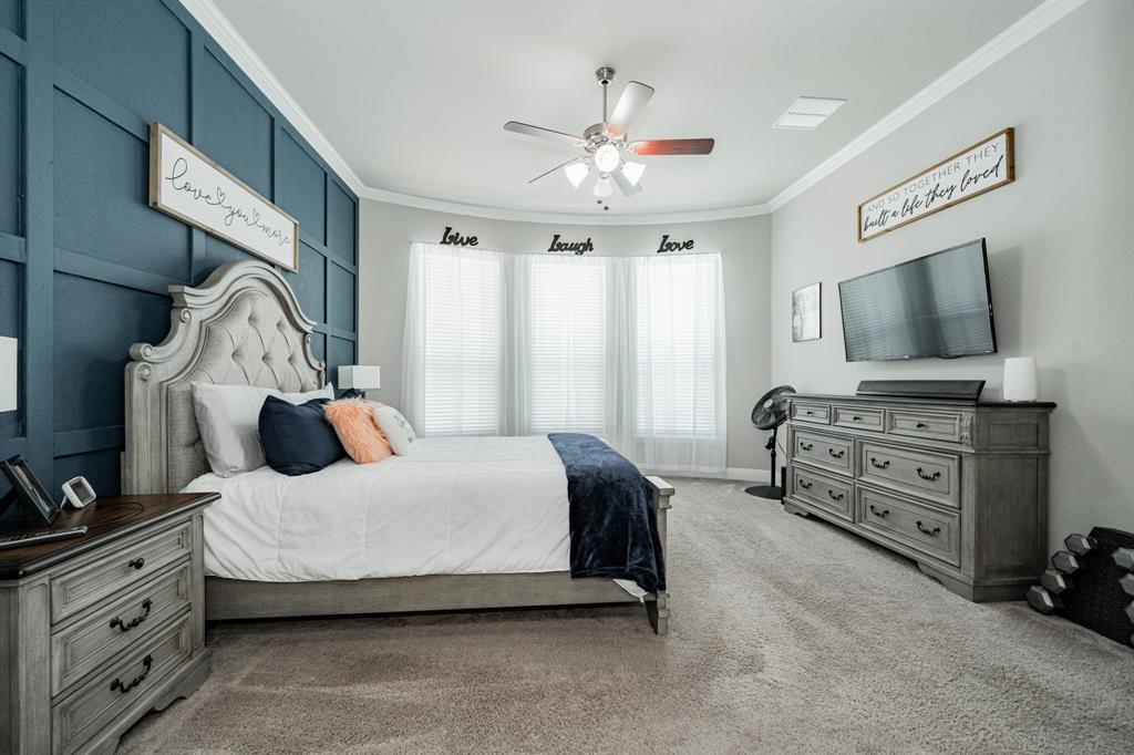 593 Spruce Trail Forney, TX 75126 - Photo 21 of 40 Bedroom featuring ornamental molding, carpet flooring, and ceiling fan