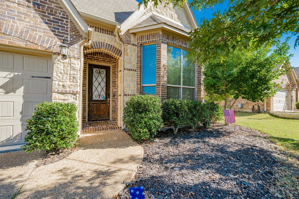 593 Spruce Trail Forney, TX 75126 - Photo 3 of 40 Doorway to property with brick siding
