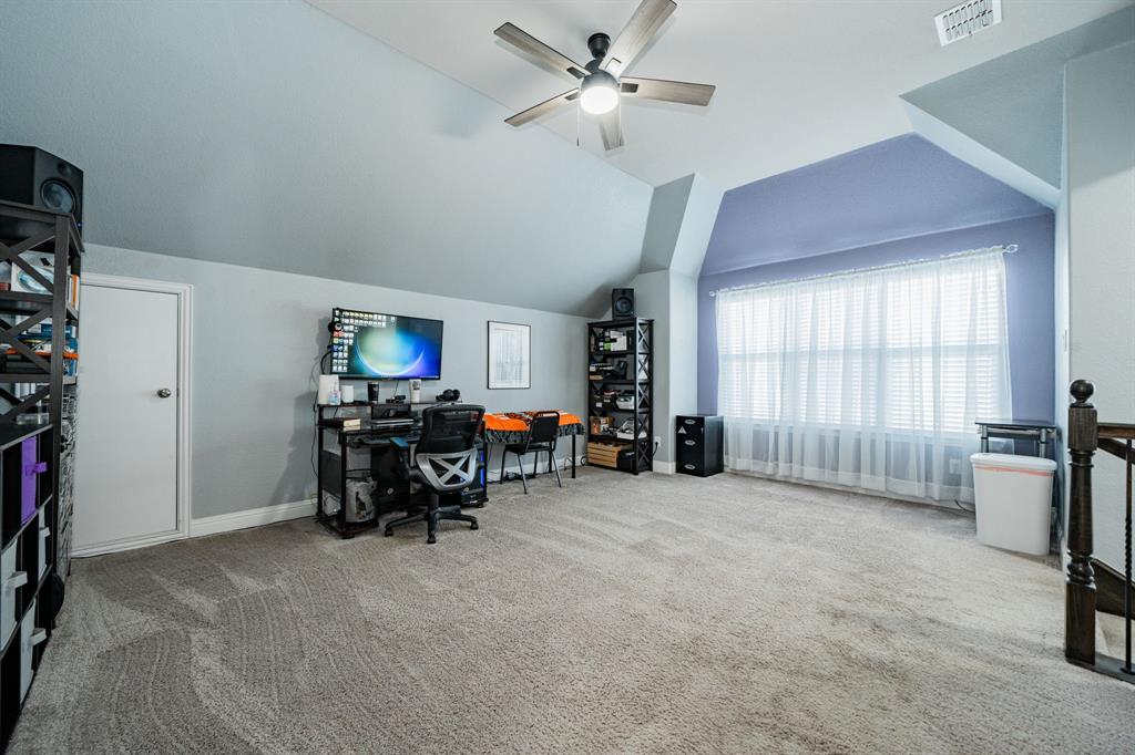 593 Spruce Trail Forney, TX 75126 - Photo 31 of 40 Office space featuring light carpet, lofted ceiling, and a ceiling fan